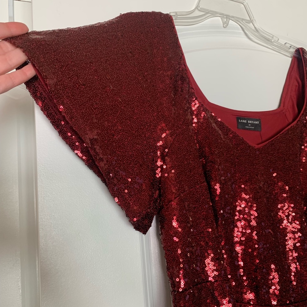 Sequin Flutter Sleeve Peplum Top - Picture 2 of 9